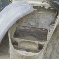 The clip, doors, fenders, hood, etc. was sandblasted and then sanded in preparation for welding and a date with our paint guy (Sierra Auto Body).