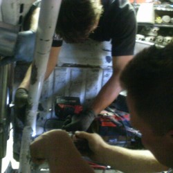 Paul and Gary drilling the cage for the shock to be installed.