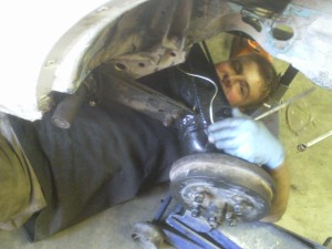 Ryan working on installing the torsion bars. He can't get away from the camera while under the car.