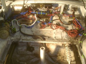 The wiring in the front behind the dash tightened up and ready to roll. A tight car is one with minimal electrical problems.